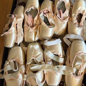 9 pairs of dead pointe shoes